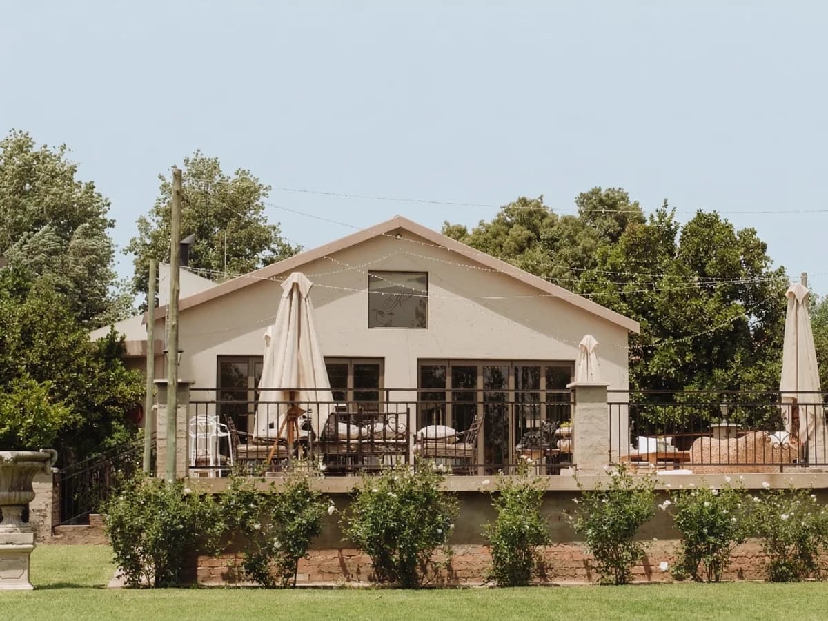 Willow Hall reception venue with timber ceilings and garden views at Riverside Estate